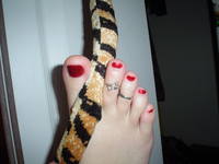 tail between toes by FootFetish