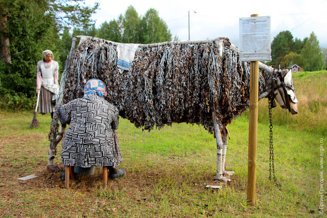 woman-milking-a-wooden-cow1 woman-milking-a-wooden-cow1