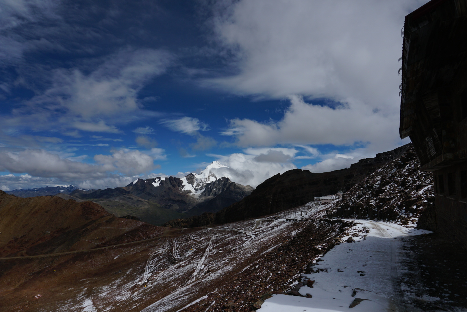 Huayna Potosí (6.088m. or 19,974 ft), the Cordillera Real, Bolívia, South America. Huayna Potosí is the closest high mountain to La Paz. Surrounded by high mountains, it is roughly 15 miles due north of the city, which makes this mountain the most popular climb in Bolivia. The normal ascent route is a fairly straightforward glacier climb, with some crevasses and a steep climb to the summit. However, the other side of the mountain -- Huayna Potosí West Face -- is the biggest face in Bolivia. Several difficult snow and ice routes ascend this 1000 meter high face.