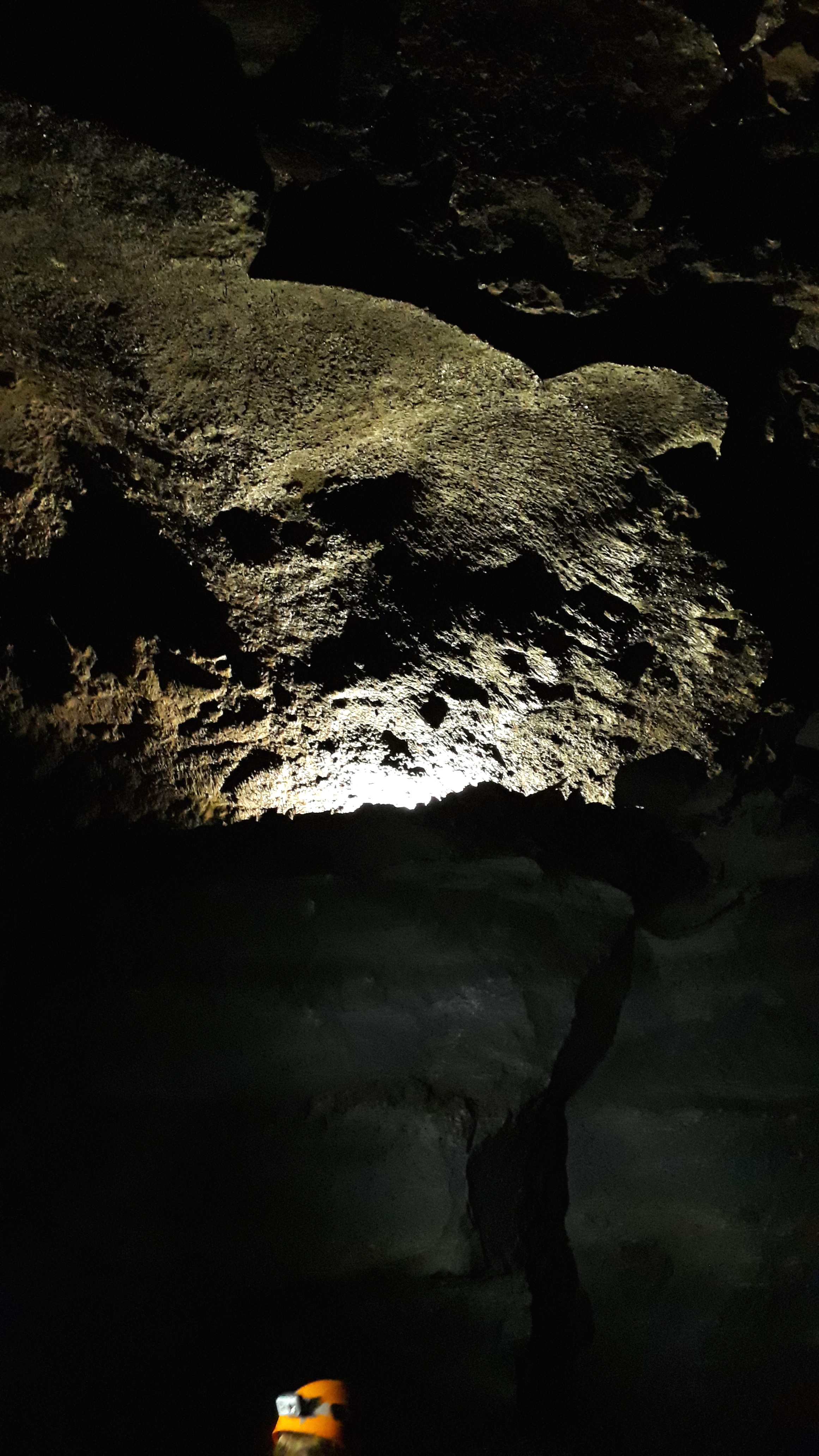 Víðgelmir lava tunnel. A Viking outlaw hid out on the ledge lit up here. They found the remains of his fire pit and bones of the stuff he'd eaten.
