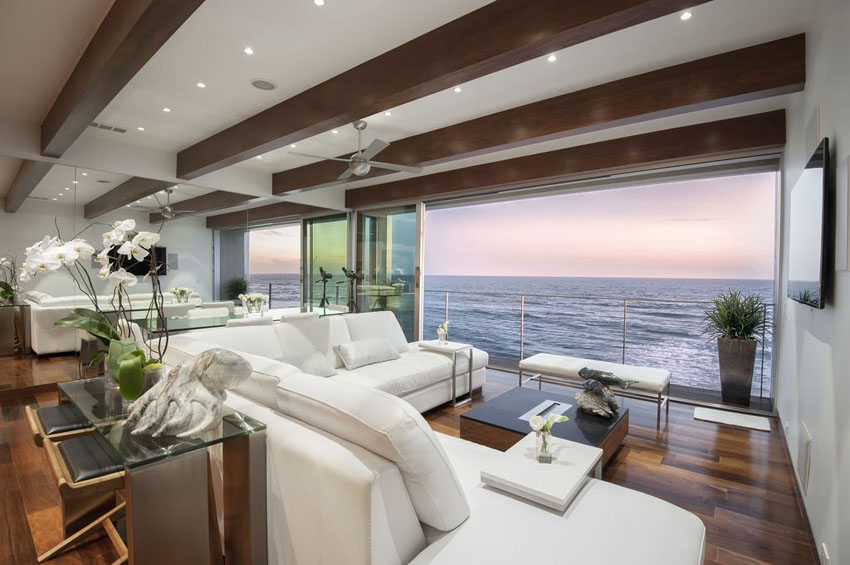 ocean-view-contemporary-living-room-with-sliding-glass-doors-wood-flooring-and-beam-ceiling