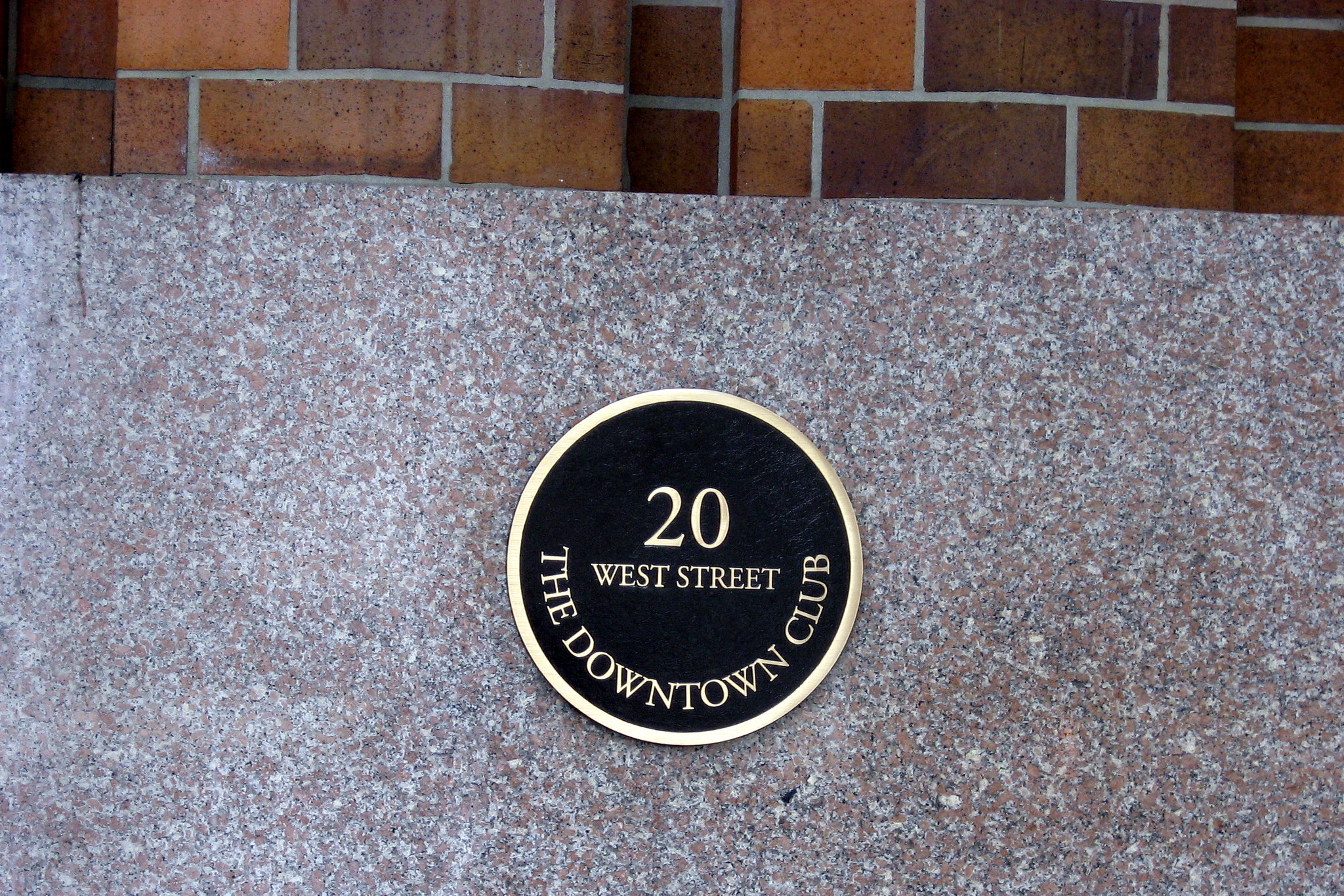 NYC - Battery: Downtown Athletic Club The Downtown Athletic Club (DAC) (left), at 19 West Street (now 18 West Street), was built from 1929 to 1930 by Starrett & Van Vleck. The Downtown Athletic Club (DAC), founded in 1926, was a private membership association geared toward businessmen and lawyers who worked in lower Manhattan. The high cost of land necessitated a tall building, and the relatively small lot size dictated that the different functions and facilities of the club, including swimming pool, gymnasium, miniature golf course, squash, and tennis courts, as well as dining rooms and living quarters, be accommodated on separate floors. The 35-story, 518-foot Art Deco tower is perhaps best known as the former "Home of the Heisman." In 1935, the club began presenting an award, originally known as the DAC Trophy. to the most outstanding player in colllegiate football. In 1936, the award was renamed the Heisman Memorial Trophy Award, following the death of the DAC's athletic director, John Heisman. Damage resulting from the attacks on Sept. 11, 2001, forced the Club to close its doors and eventually declare bankruptcy. The Heisman presentation was relocated temporarily to the Yale Club, then to the Hilton New York and since 2005, has resided at the Nokia Theatre Times Square. The Downtown Athletic Club was designated a landmark by the New York Landmarks Preservation Commission in 2000.