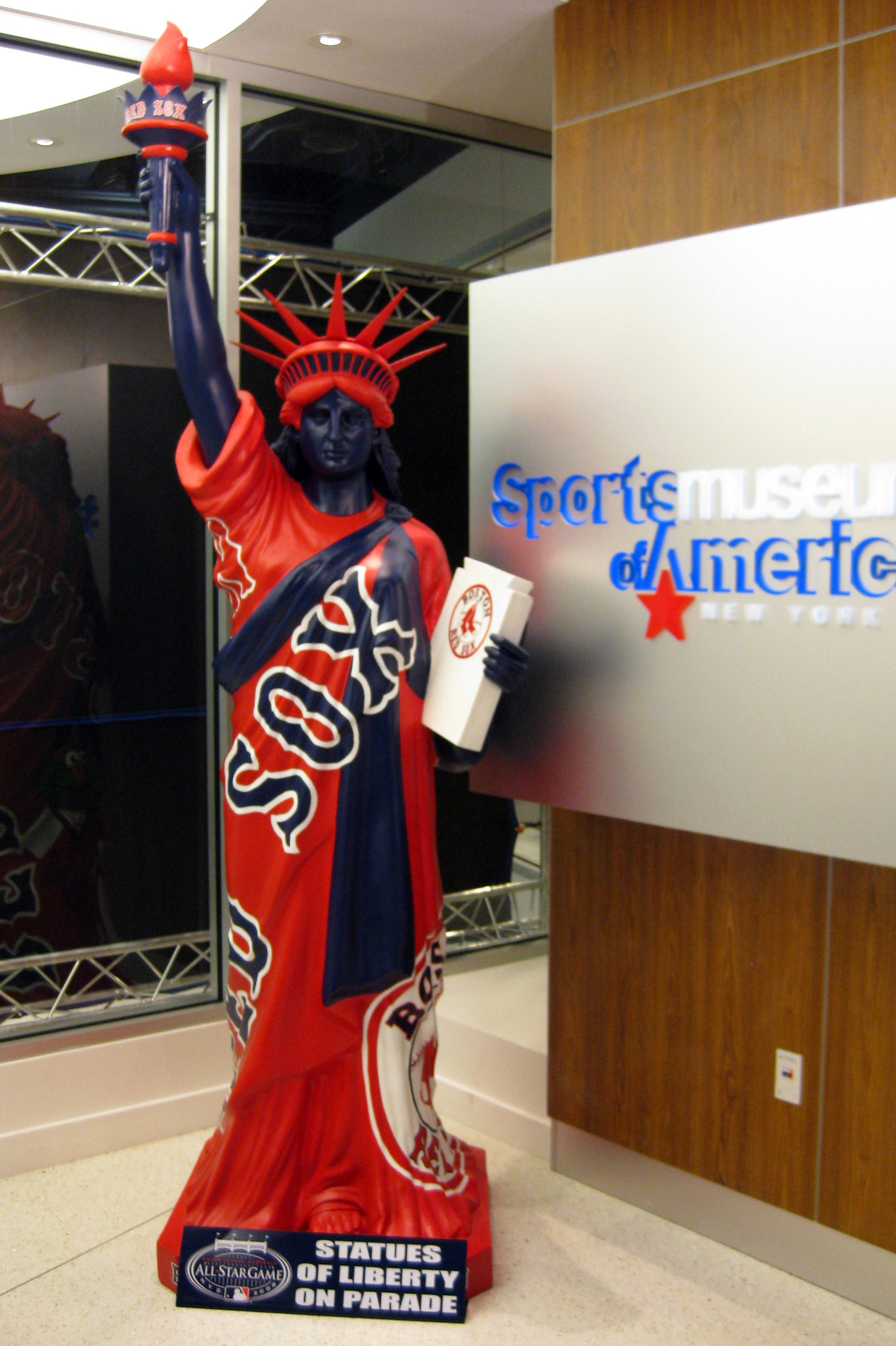 NYC - Statues of Liberty on Parade: Boston Red Sox To celebrate the 2008 Major League Baseball All Star Game, which took place in Yankee Stadium, in its final season, on July 15, 2008, Major League Baseball launched "Statues on Parade." Forty-two replicas of the Statue of Liberty were stationed around the city leading up to the game--each uniquely designed with bold graphics and colors featuring each of the 30 Major League Baseball clubs, the Brooklyn Dodgers, the New York Giants, the American League, the National League, four All-Star statues and statues commemorating the final season of Yankee Stadium and Shea Stadium. The 8½ feet tall, 250-pound statues are made of resin and rest on a 530-pound cement base. The Boston Red Sox statue stood inside the Sports Museum of America at 26 Broadway. For other statues from Statues of Liberty on Parade, check my tag StatuesofLibertyonParade