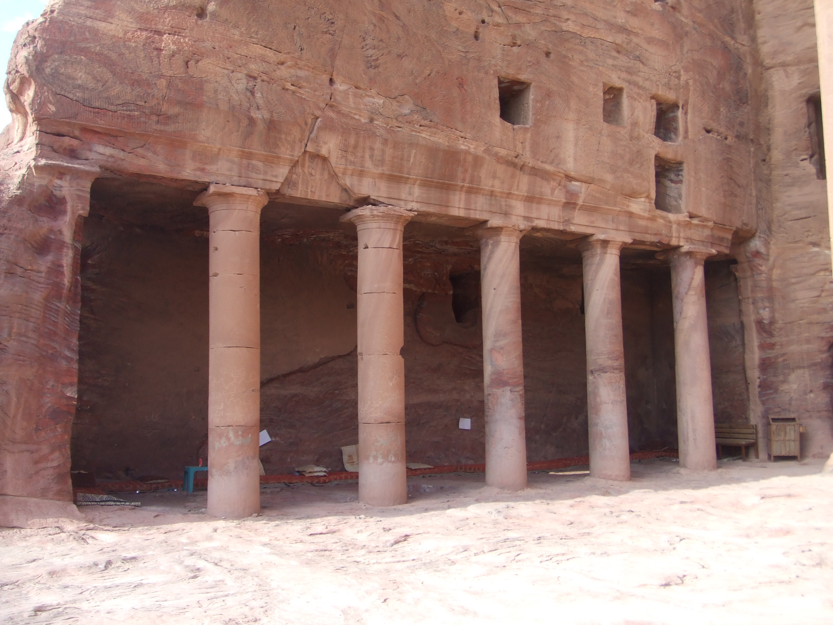 The Urn Tomb, Petra The east cliff contains a sequence of some of the most important tomb facades in Petra, including the Palace Tomb, the Corinthian Tomb, and the Urn Tomb. Some of the many tomb facades that can be seen all over Petra, probably dating from the 1st century BC. These combine architectural characteristics unique to Nabatean Petra, with classical facades surmounted by step-like motifs, distinctly more eastern forms.