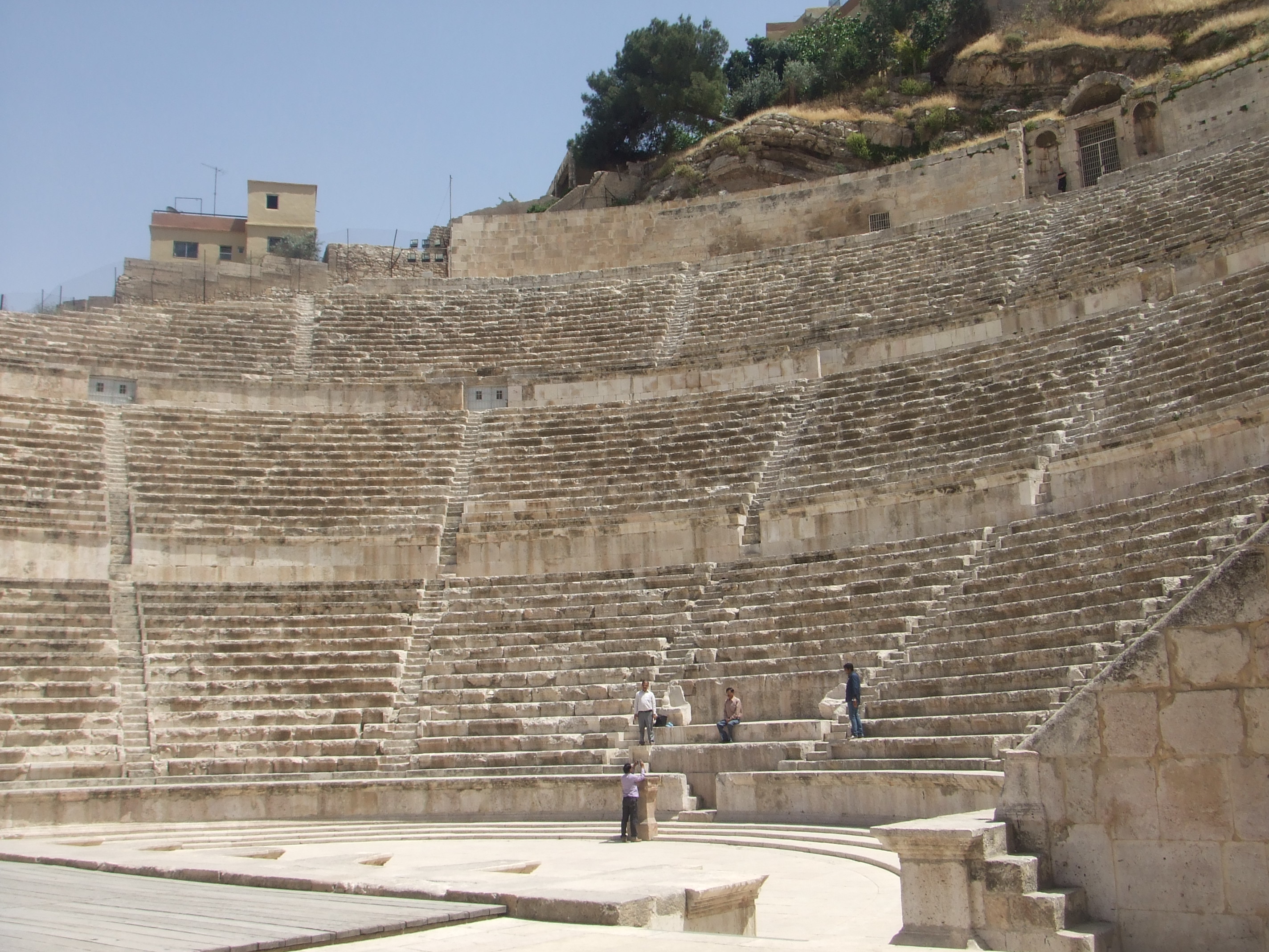 Amphitheatre, Amman Amman's city centre may have a modern feel today but is actually one of the oldest continuously inhabited cities in the World, with evidence of its classical past (as the ancient city of Philadelphia) still visible in certain areas. The most important remaining monument of the city's classical past is the stunning Roman amphitheatre. The theatre was built the reign of Antonius Pius (138-161 AD) and could seat up to 6,000 people. Built into the hillside, it was oriented north to keep the fierce sun off the spectators.