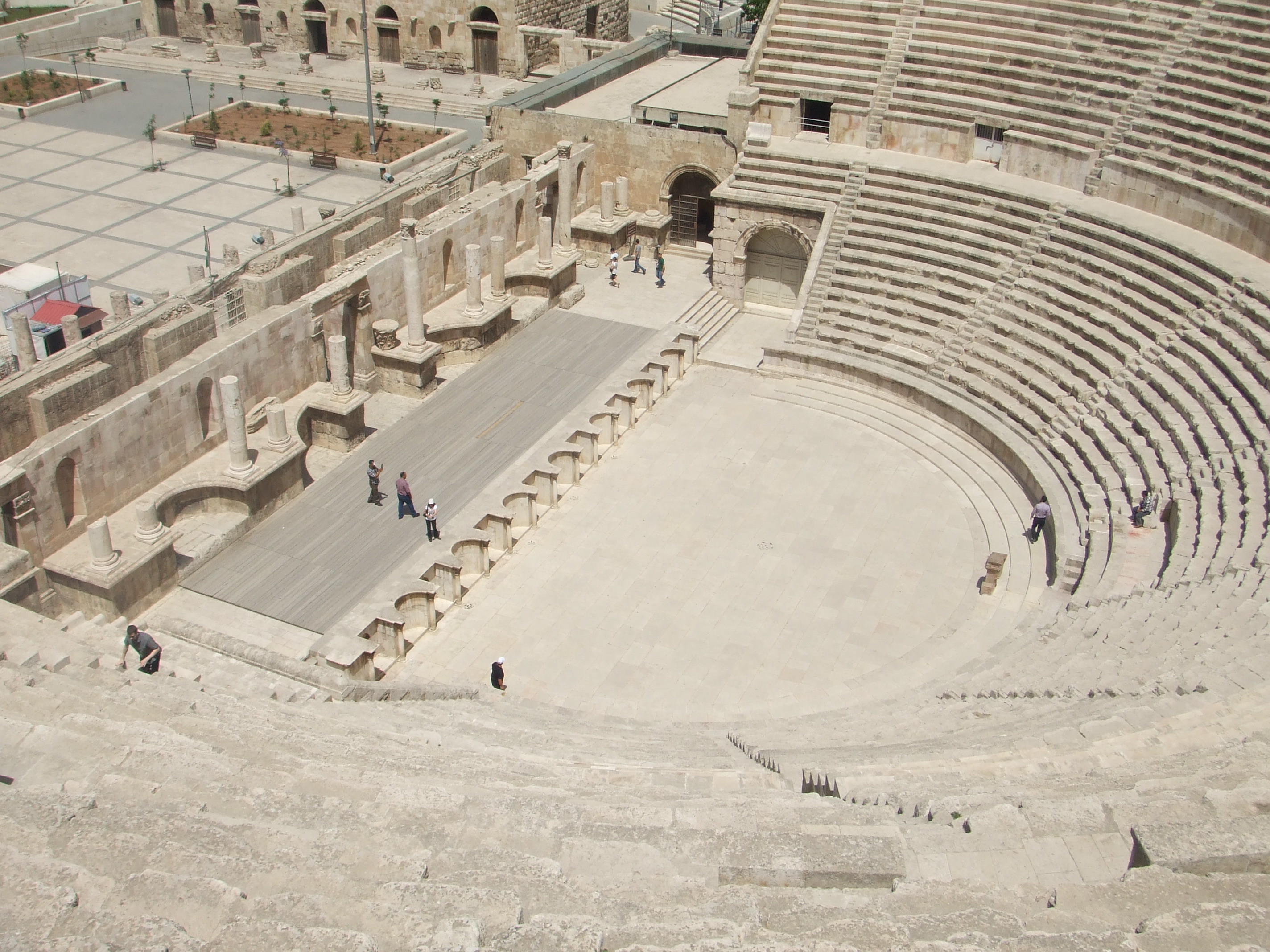 Amphitheatre, Amman Amman's city centre may have a modern feel today but is actually one of the oldest continuously inhabited cities in the World, with evidence of its classical past (as the ancient city of Philadelphia) still visible in certain areas. The most important remaining monument of the city's classical past is the stunning Roman amphitheatre. The theatre was built the reign of Antonius Pius (138-161 AD) and could seat up to 6,000 people. Built into the hillside, it was oriented north to keep the fierce sun off the spectators.