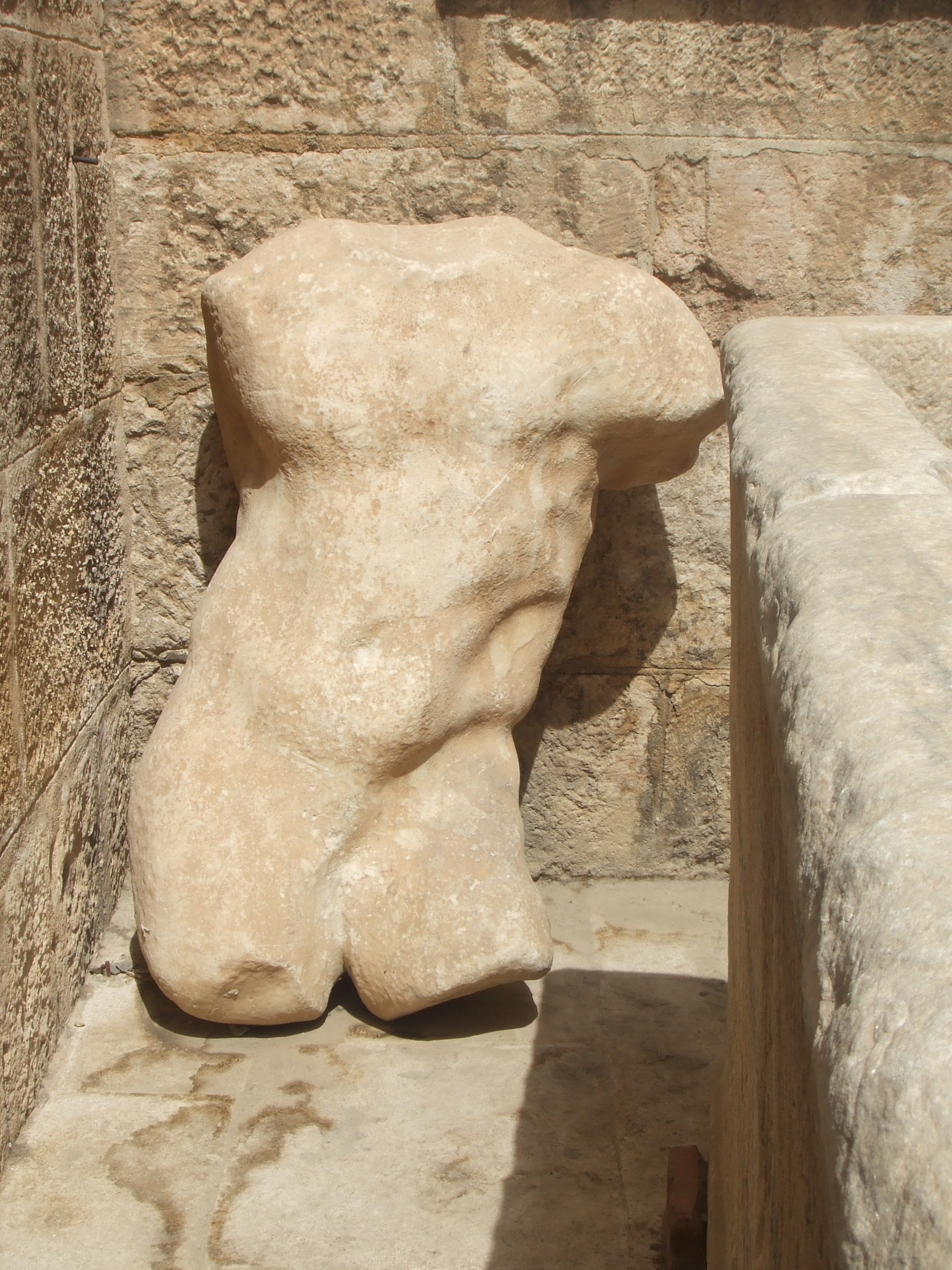 Torso, Amphitheatre, Amman Amman's city centre may have a modern feel today but is actually one of the oldest continuously inhabited cities in the World, with evidence of its classical past (as the ancient city of Philadelphia) still visible in certain areas. The most important remaining monument of the city's classical past is the stunning Roman amphitheatre. The theatre was built the reign of Antonius Pius (138-161 AD) and could seat up to 6,000 people. Built into the hillside, it was oriented north to keep the fierce sun off the spectators.