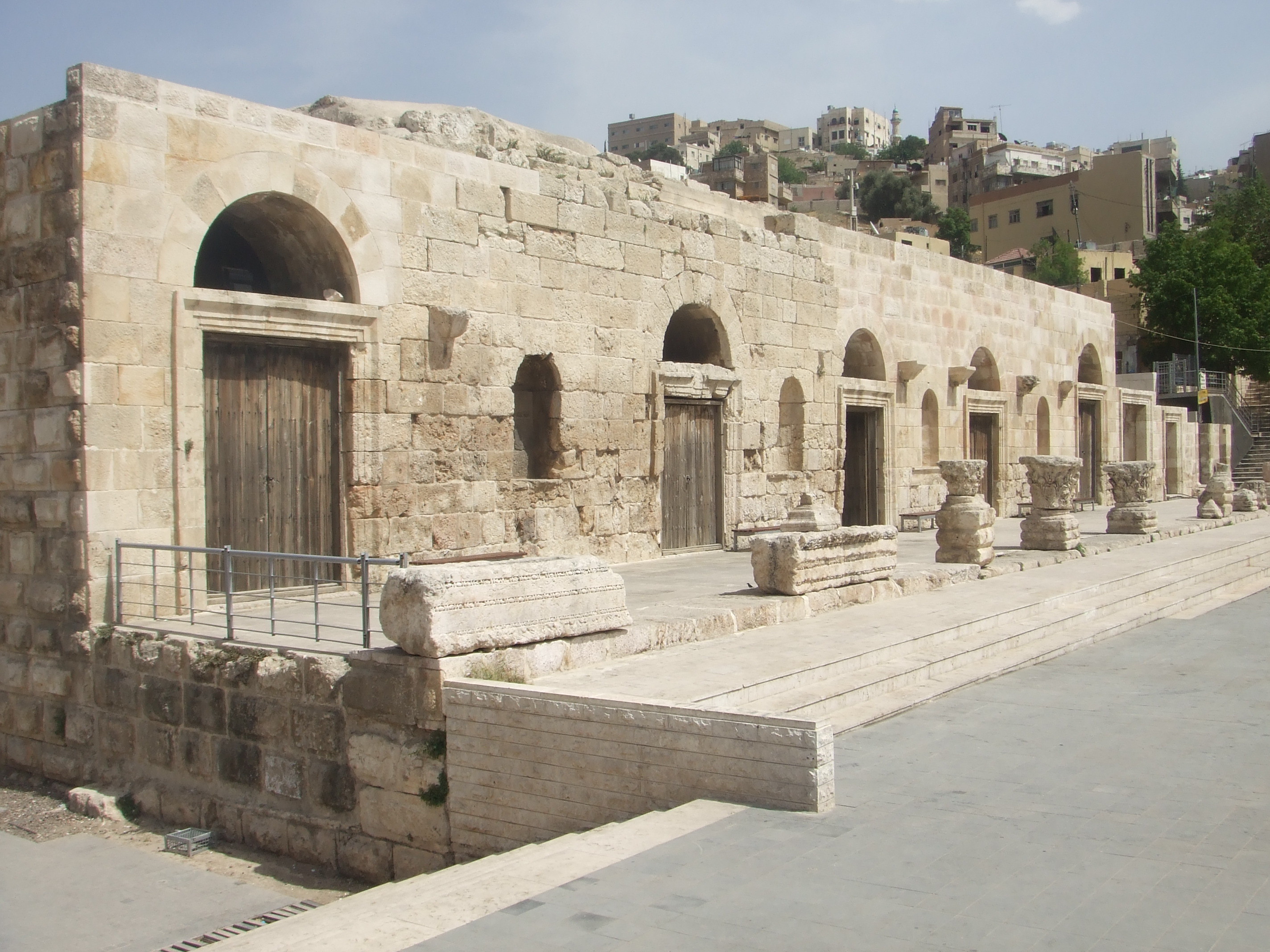 Odeon, Amman The Odeon sits in Hashemite Square adjacent to the much larger amphitheatre and accessible with the same ticket. Amman's city centre may have a modern feel today but is actually one of the oldest continuously inhabited cities in the World, with evidence of its classical past (as the ancient city of Philadelphia) still visible in certain areas. The most important remaining monument of the city's classical past is the stunning Roman amphitheatre. The theatre was built the reign of Antonius Pius (138-161 AD) and could seat up to 6,000 people. Built into the hillside, it was oriented north to keep the fierce sun off the spectators.