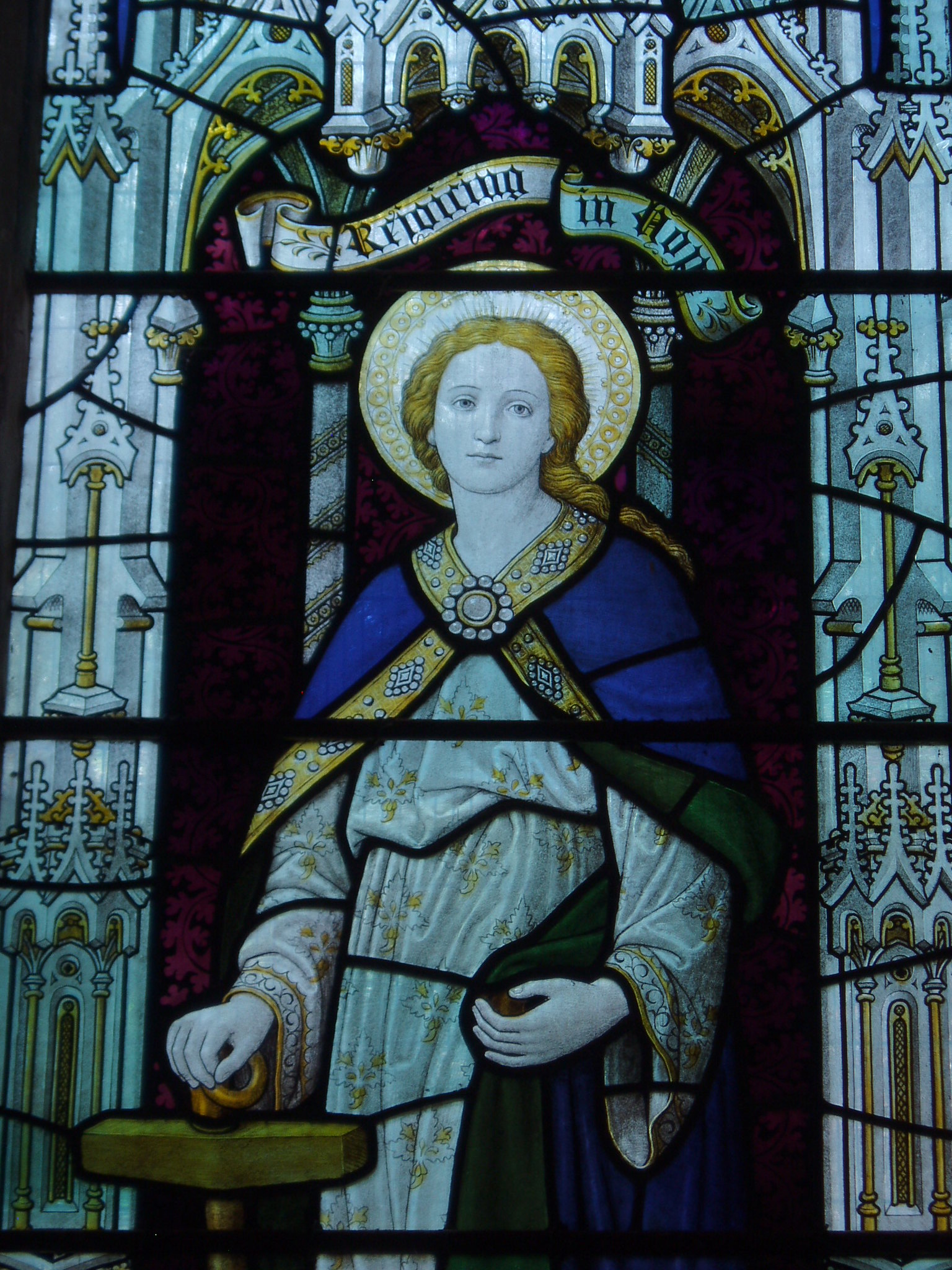 Hope, Mickleton North aisle window by Burlison & Grylls, c1927. St Lawrence's church at Mickleton is a fairly large building with a Transitional nave flanked by unusually spacious aisles and surmounted by a soaring steeple at the west end. The nave arcades show the transition from Norman to Gothic styles in their broad round arches and carved capitals. The church was restored by Preedy in 1868, the glass in the east window is his work. This attractive church is normally open and welcoming to visitors in daylight hours.
