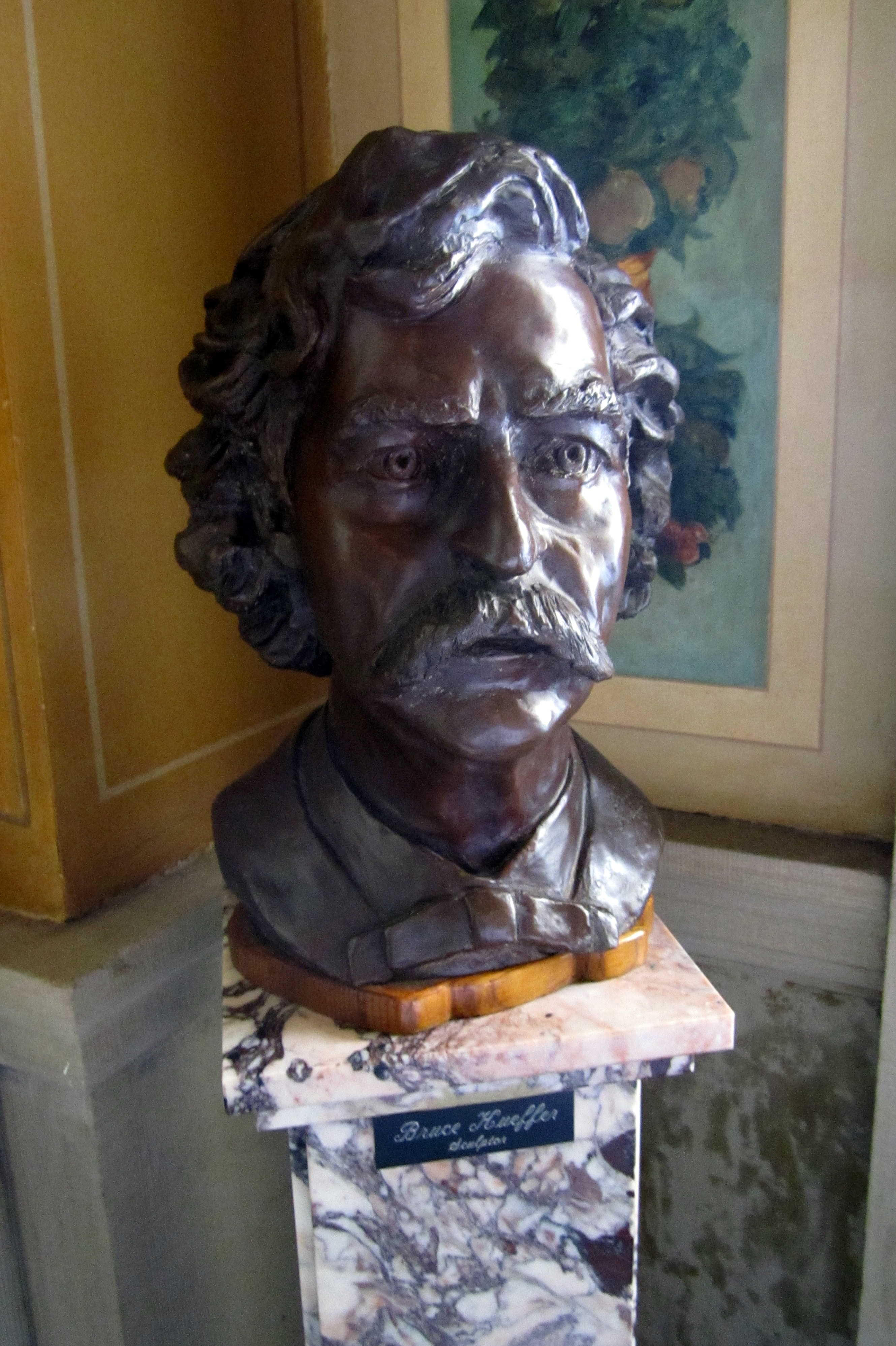 Boston - Back Bay: Boston Public Library McKim Building - Mark Twain This sculptural bust of Mark Twain, by Bruce Kueffer, is on display at the Boston Public Library McKim Building. The Boston Public Library McKim Building, located on Boylston Street between Dartmouth and Exeter Streets, was built in 1895 by Charles Follen McKim of McKim, Mead & White. Consisting of a three-story, monumental free-standing block in the style of an Italian Renaissance palace surrounding an open courtyard, McKim's design was one of the earliest successful examples of Renaissance Beaux-Arts Classicism in America, and set the precedent for grand scale urban libraries. In 1972, the Philip Johnson-designed late modernist wing was added to the Central Library location. The Boston Public Library system, established in 1848, was the country's first publicly supported municipal library, its first large library open to the public and its first to allow citizens to borrow books. There are currently twenty-six branches in the system.