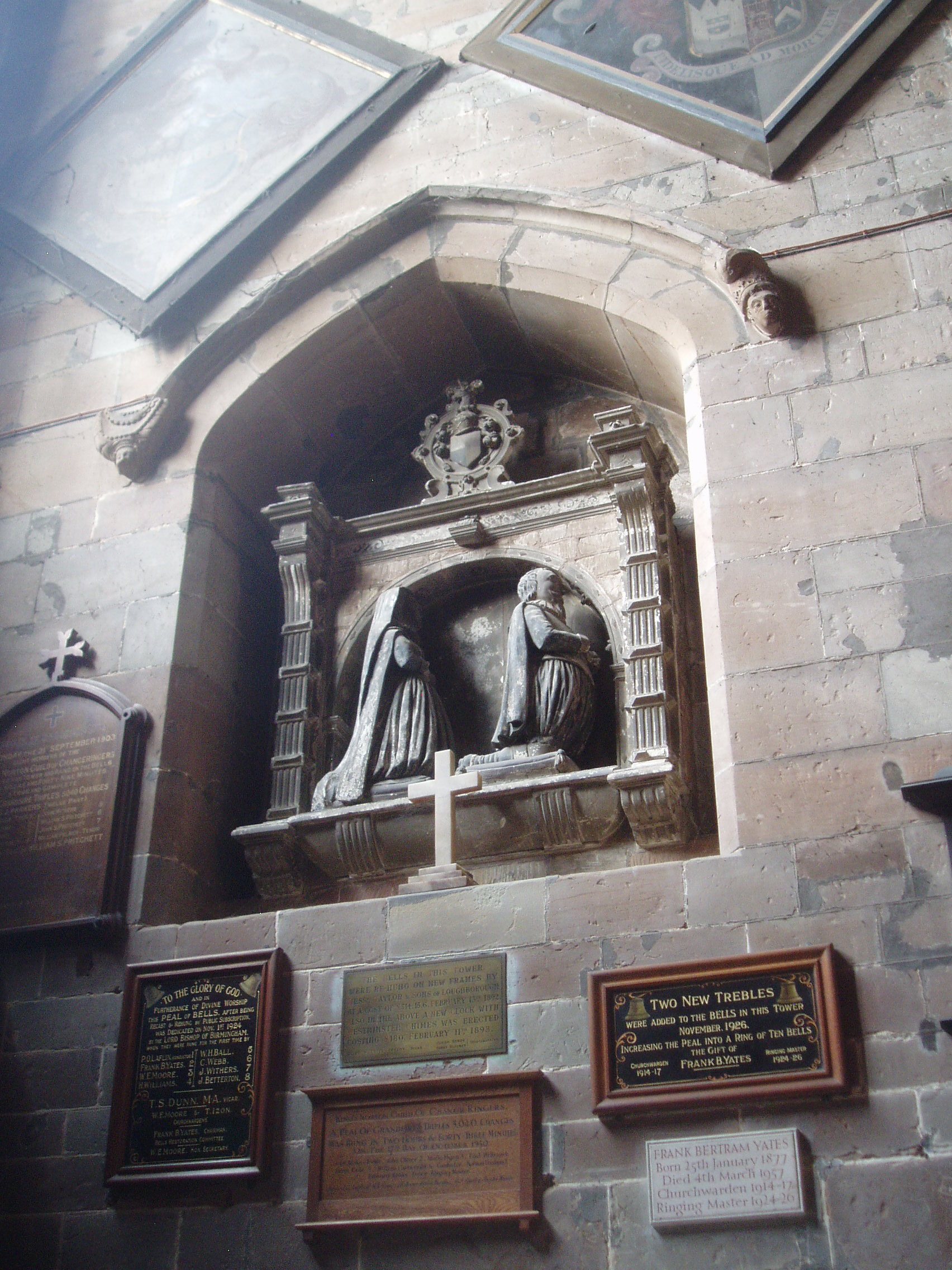 Memorial, King's Norton St Nicholas's in King's Norton is one of the most impressive medieval churches within the suburbs of present day Birmingham. It is distinguished by a lofty tower and spire of mid 15th century date (similar to that at Coleshill) which given the elevated site is a landmark visible for some distance. The bulk of the church building is of 15th century date though it is much earlier in origin, with remnants of the 12th century Norman building at the north east corner of the chancel (one window opening remains). The building has been restored and altered over the centuries following the Reformation, most noticeably in the south aisle where a new roof with series of gables with windows was added to admit greater light to the otherwise fairly dark interior. The church was restored in the 1880s by Ewan Christian. Inside the furnishings are mostly Victorian except for the surviving lower part of the 15th century wooden rood screen with a carved foliate frieze. There is also a fine group of post-Reformation monuments which are somewhat hard to appreciate (and photograph!) in the gloomy space under the tower (where they were moved to from the chancel in the Victorian restoration). The church contains much Victorian stained glass, much of it by Hardman's of Birmingham, with an east window by the studio of C.E.Kempe. The church is normally kept locked but has select open hours on wednesdays and saturdays for visitors who are made very welcome! www.kingsnorton.org.uk/churches/st-nicolas-ancient-stones... The church forms a group of fine medieval buildings along with the Old Grammar School (in the churchyard) and the former Saracen's Head/Tudor Merchant's House which formed the winning project of the BBC's Restoration series in 2004.