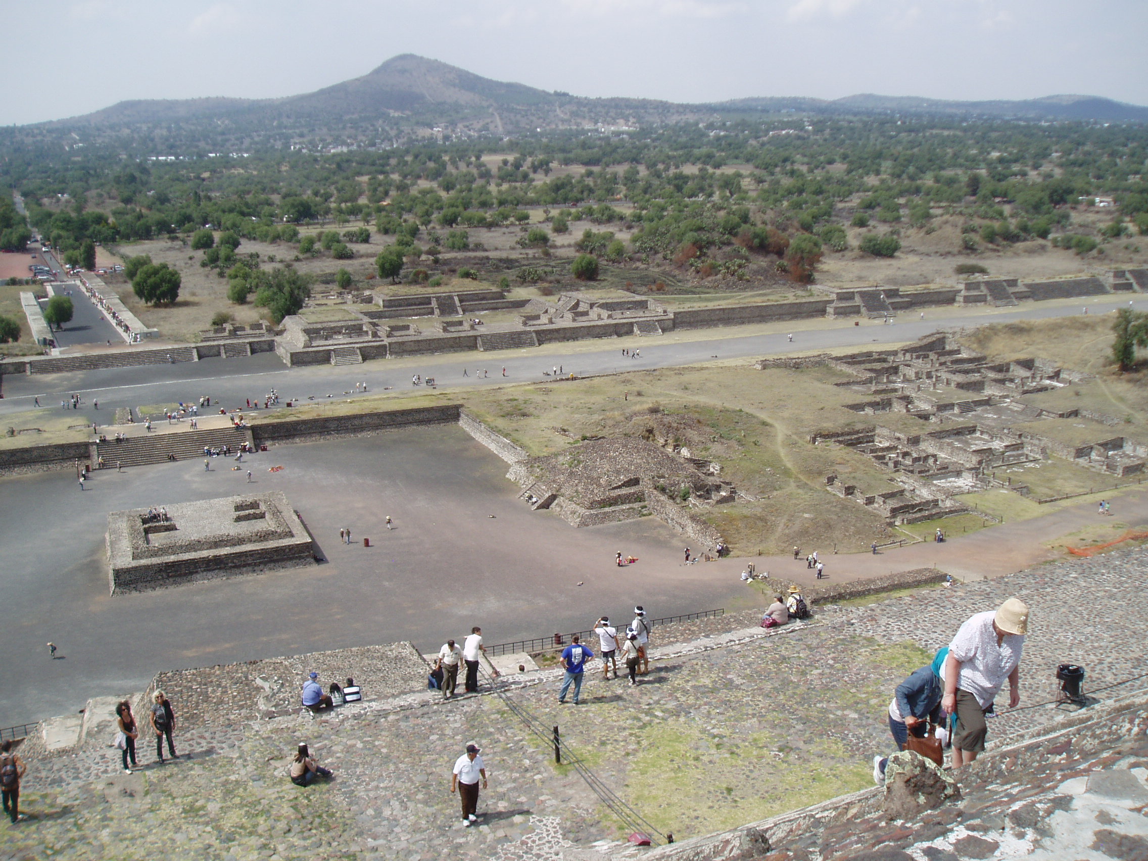 Teotihuacan Teotihuacan is one of the most famous and important sites of ancient Mexico, best known for it's enormous Avenue of the Dead and the great pyramids of the Sun and Moon. Although the site was known in Aztec times as the 'Birthplace of the Gods' it is actually significantly older, with most of the major structures built between 100-250AD and the city, one of the largest ever ancient settlements in the Americas, was believed to have been still inhabited up to the 8th century. Today the vast scale of the complex, particularly the so called Avenue of the Dead, nearly 3km long and flanked by ancient ruins and terraces, continues to awe visitors. At the north end of the Avenue sits the Pyramid of the Moon, whilst it's much larger counterpart, the Pyramid of the Sun, sits halfway up it's eastern side. At the southern end sits the Ciudadela complex which centres on the smaller pyramid of Quetzelcoatl, earlier and more ruined than the larger pyramids but retaining it's stunning original sculptural decoration on part of it's western face, featuring the iconic feathered serpent heads. Aside from the great ceremonial structures there are also residential buildings, particularly the palatial complex at the north west corner that retains some vivid fragments of it's original mural decoration. en.wikipedia.org/wiki/Teotihuacan