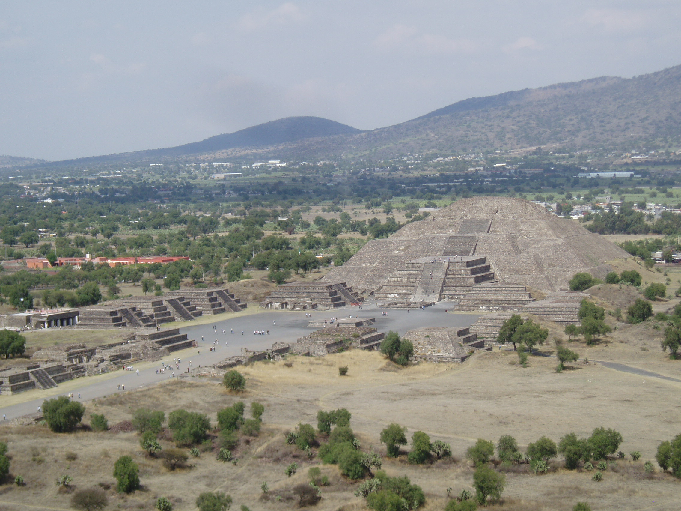 Pyramid of the Moon, Teotihuacan Teotihuacan is one of the most famous and important sites of ancient Mexico, best known for it's enormous Avenue of the Dead and the great pyramids of the Sun and Moon. Although the site was known in Aztec times as the 'Birthplace of the Gods' it is actually significantly older, with most of the major structures built between 100-250AD and the city, one of the largest ever ancient settlements in the Americas, was believed to have been still inhabited up to the 8th century. Today the vast scale of the complex, particularly the so called Avenue of the Dead, nearly 3km long and flanked by ancient ruins and terraces, continues to awe visitors. At the north end of the Avenue sits the Pyramid of the Moon, whilst it's much larger counterpart, the Pyramid of the Sun, sits halfway up it's eastern side. At the southern end sits the Ciudadela complex which centres on the smaller pyramid of Quetzelcoatl, earlier and more ruined than the larger pyramids but retaining it's stunning original sculptural decoration on part of it's western face, featuring the iconic feathered serpent heads. Aside from the great ceremonial structures there are also residential buildings, particularly the palatial complex at the north west corner that retains some vivid fragments of it's original mural decoration. en.wikipedia.org/wiki/Teotihuacan
