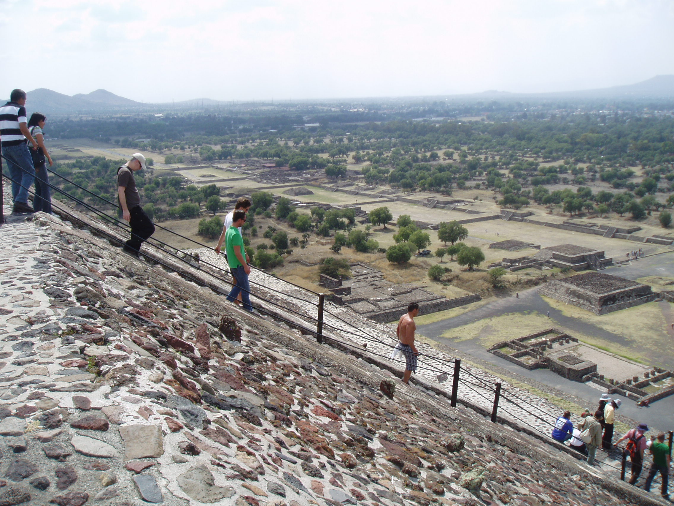 Descending the Pyramid, Teotihuacan Teotihuacan is one of the most famous and important sites of ancient Mexico, best known for it's enormous Avenue of the Dead and the great pyramids of the Sun and Moon. Although the site was known in Aztec times as the 'Birthplace of the Gods' it is actually significantly older, with most of the major structures built between 100-250AD and the city, one of the largest ever ancient settlements in the Americas, was believed to have been still inhabited up to the 8th century. Today the vast scale of the complex, particularly the so called Avenue of the Dead, nearly 3km long and flanked by ancient ruins and terraces, continues to awe visitors. At the north end of the Avenue sits the Pyramid of the Moon, whilst it's much larger counterpart, the Pyramid of the Sun, sits halfway up it's eastern side. At the southern end sits the Ciudadela complex which centres on the smaller pyramid of Quetzelcoatl, earlier and more ruined than the larger pyramids but retaining it's stunning original sculptural decoration on part of it's western face, featuring the iconic feathered serpent heads. Aside from the great ceremonial structures there are also residential buildings, particularly the palatial complex at the north west corner that retains some vivid fragments of it's original mural decoration. en.wikipedia.org/wiki/Teotihuacan