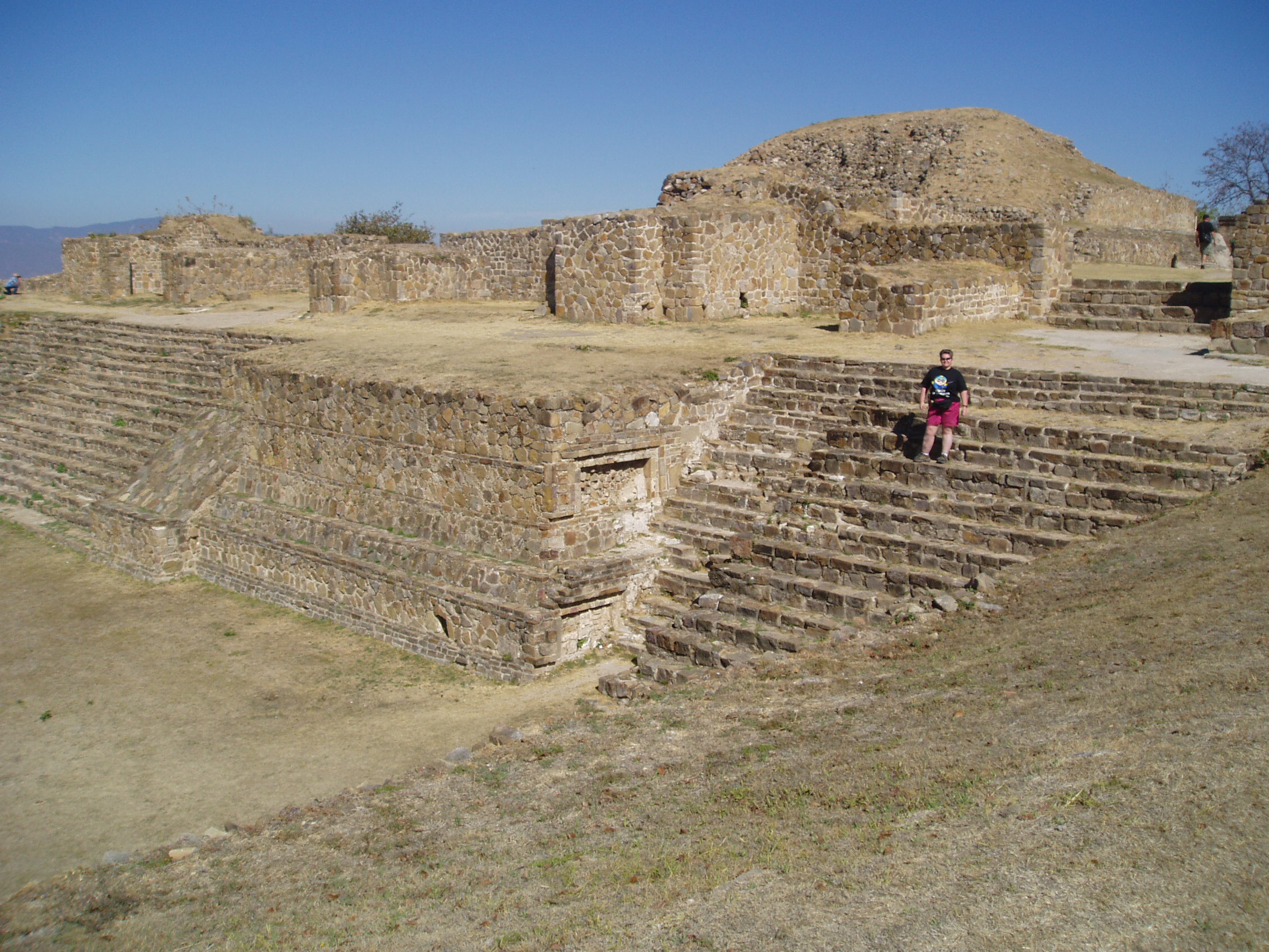 Zapotec Ruins, Monte Alban The ancient site of Monte Alban stands in a commanding position atop a low mountainous range overlooking the city of Oaxaca, a spectacular vantage point with superb views across the surrounding countryside. The ruins are amongst the earliest in Mexico dating back to c500BC and the product of Zapotec culture. It was inhabitated up to it's decline as a city between c500-750AD, after which it was mostly abandoned and forgotten. The site is an a huge scale with vast ceremonial courtyards and several pyramid-like structures and temple platforms, many with grand staircases giving access to higher levels. There is also a ball court and a sequence of relief sculptures, known as the 'Dancers' due to their strange contortions (but considered more likely to be sacrificial victims or prisoners!). Several tombs have been found at the site, and some fine pre-Columbian treasures were found, now on display in the archaeological museum in Oaxaca. en.wikipedia.org/wiki/Monte_Alb%C3%A1n