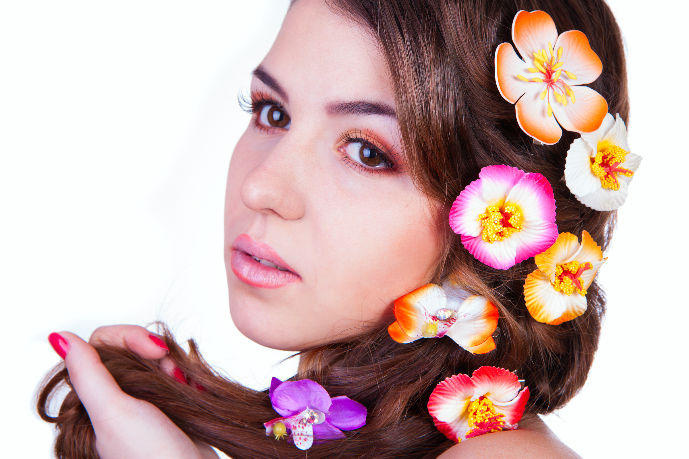 close up portrait of youndg beautiful girl holding hair in hand