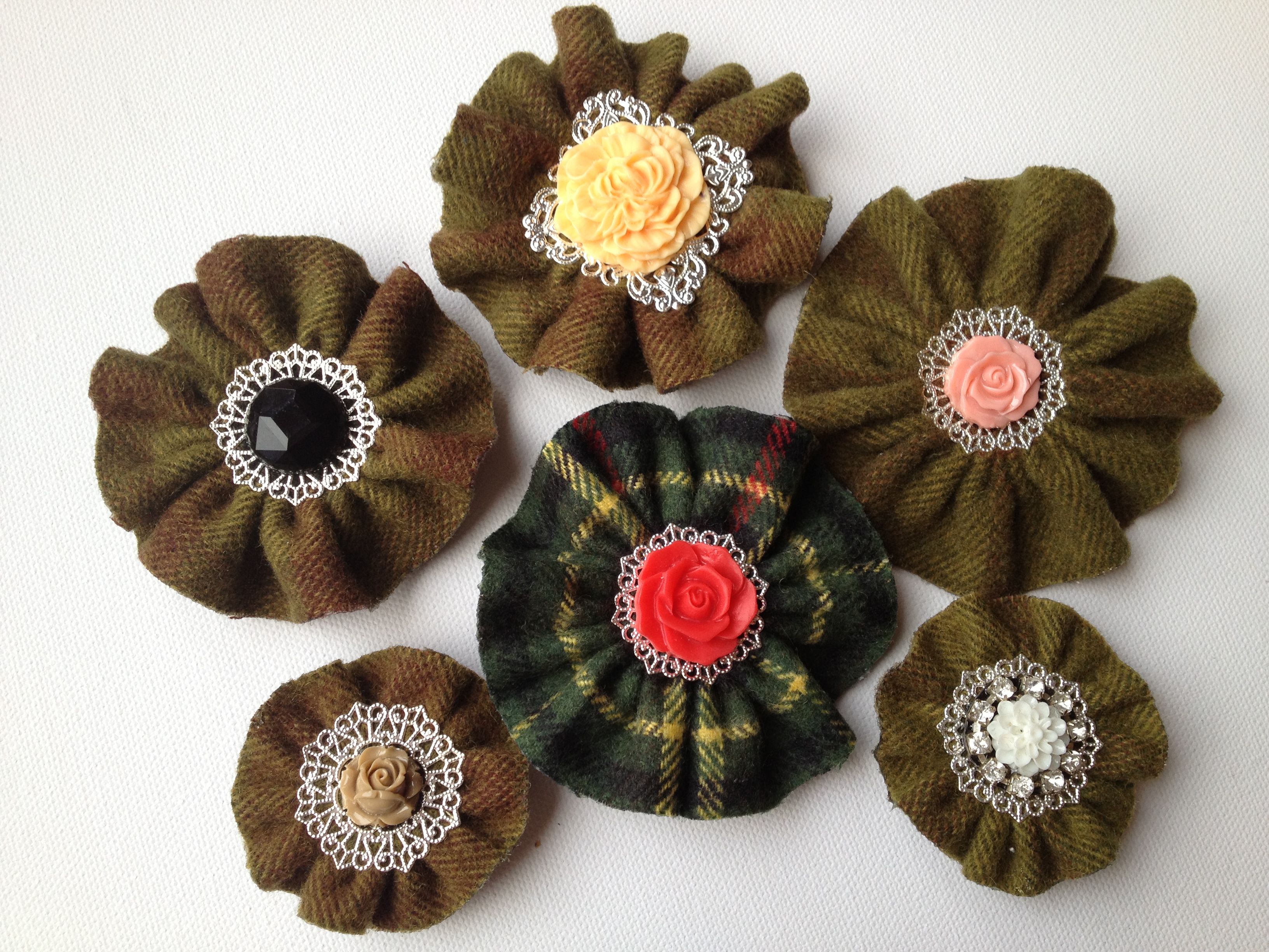 green tartan brooches together.JPG