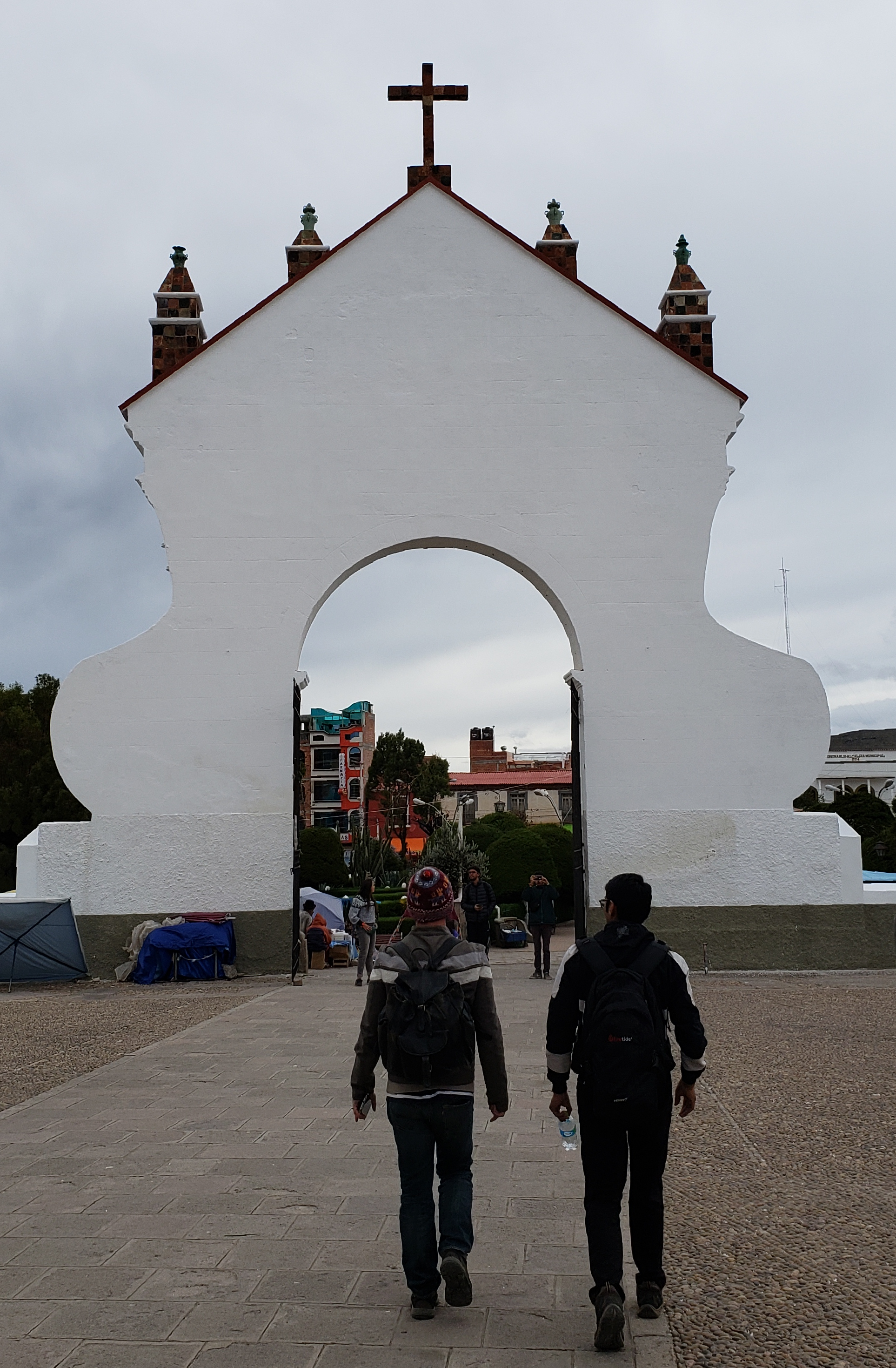 Basilica of Our Lady of Copacabana, Copacabana, Bolivia. The sparkling white mudéjar (Moorish–style) cathedral, with its domes and colorful azulejos (blue Portuguese-style ceramic tiles), dominates the town. Check the noticeboard in front of the entrance for the mass schedule. The cathedral’s black Virgen de Candelaria statue, Camarín de la Virgen de Candelaria, carved by Inca Emperor Tupac-Yupanqui’s grandson, Francisco Yupanqui, is encased above the altar upstairs in the camarín (shrine); visiting hours can be unreliable. The statue is never moved from the cathedral, as superstition suggests that its disturbance would precipitate a devastating flood of Lake Titicaca. Museo de la Catedral contains some interesting religious art.