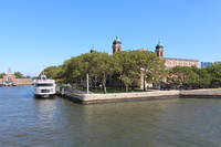 Ellis Island: Main Building - Registry Room The Main Building at Ellis Island was originally built in 1898-1900 to the Beaux Arts design of Boring & Tilton and carried out under the supervision of James Know Taylor. Its Great Hall, or Registry Room, processed 5,000 immigrants a day in the early to mid 20th century. In the late 1980's, the National Park Service restored the building and today it serves as the Ellis Island Immigration Museum. Ellis Island, in Upper New York Bay, was the gateway for over 12 million immigrants to the United States as the nation's busiest immigrant inspection station from 1892 until 1854. Prior to being expansion with land reclamation for this purpose, it was the site of Fort Gibson and later a naval magazine. The island was made part of the Statue of Liberty National Monument in 1965 and has hosted a museum of immigration since 1990. The interior of the Ellis Island Main Building was was designated a historic landmark by the New York City Landmarks Preservation Commission in 1993. The Ellis Island Historic District was designated a historic district by the New York City Landmarks Preservation Commission in 1993. Statue of Liberty National Monument New Jersey State Register (1971) Statue of Liberty National Monument National Register #66000058 (1966)