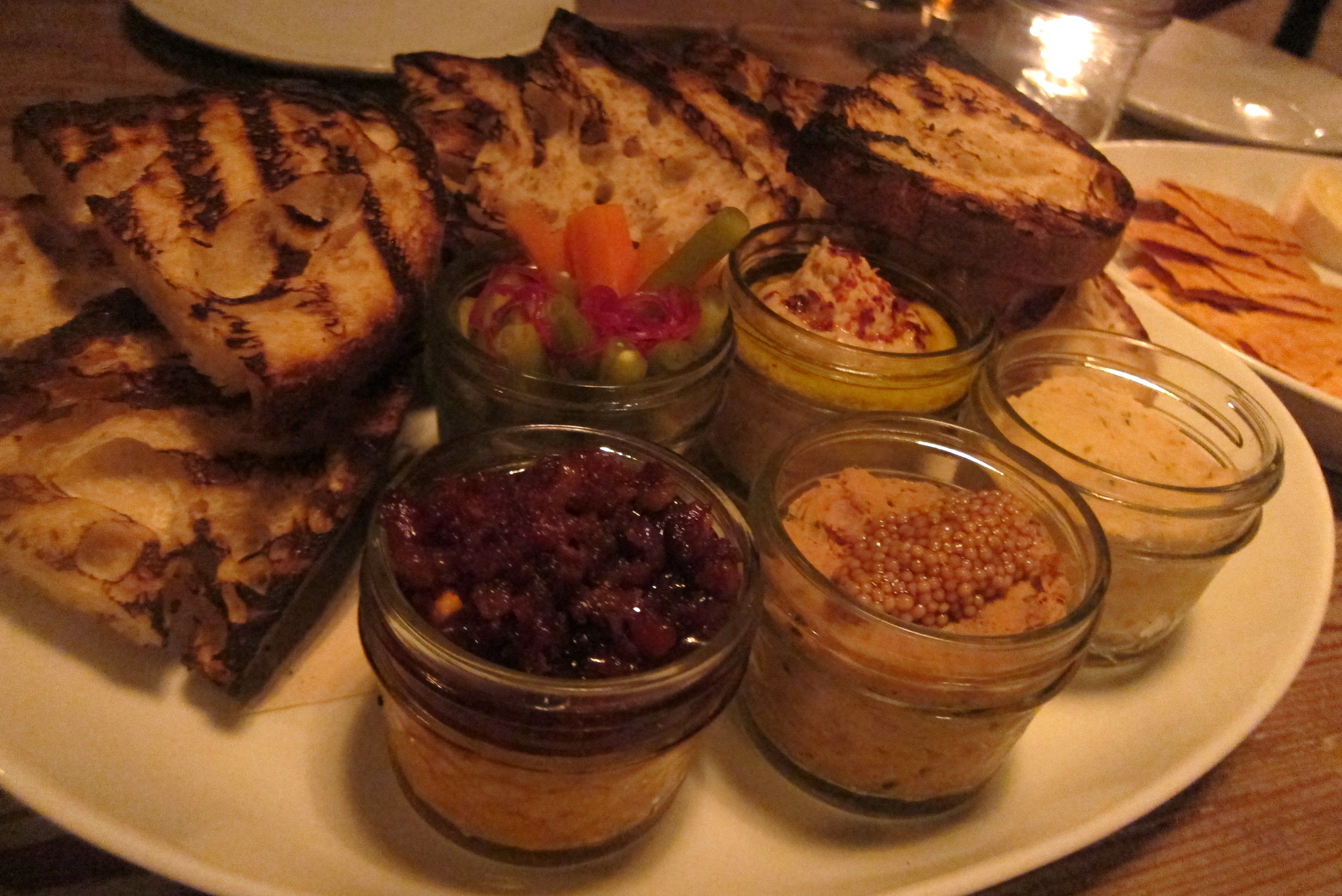 Atlanta - Midtown: Empire State South - In Jars In Jars, at Empire State South, includes deviled ham, trout mousse, pickles, pimento cheese & bacon marmalade, boiled peanut hummus Empire State South, located at 999 Peachtree Street NE, was opened in 2010 by chef-owner Hugh Acheson. It is the third eatery from Canadian native Hugh Acheson, who had previously opened First & Ten in 2000 and The National in 2007, both in Athens, Georgia. Acheson, a competitor on Top Chef Masters and a judge on Top Chef, had previously worked at the iconic Café Henry Burger in his hometown of Ottawa, and Gary Danko's Danko in San Francisco. After six years of nominations, he was named the co-winner of the 2012 James Beard Foundation Award for Best Chef: Southeast. Executive Chef Ryan Smith had previously worked in some of Atlanta's most prominent restaurants including Bacchanalia, Canoe, Restaurant Eugene and Holeman & Finch. Smith announced in April 2013 that he was leaving Empire State South by year end to join as a partner in Staplehouse, conceived by Ryan and Jen Hidinger.