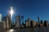Downtown NYC One World Trade Center, formerly known as the Freedom Tower, is the main building of the 16-acre rebuilt World Trade Center complex. Designed in the contemporary modern style by David Childs of Skidmore, Owings & Merrill (SOM), construction started in 2006, was topped off in 2012, and the building opened in 2014. The supertall structure, which has the same name as the North Tower of the original World Trade Center and sits on the site of the original 6 World Trade Center--both of which were destroyed in the terrorist attacks of September 11, 2001--was, at its completion, the tallest in North America and the sixth tallest in the world, reaching a height of 1,776 feet, including its spire.