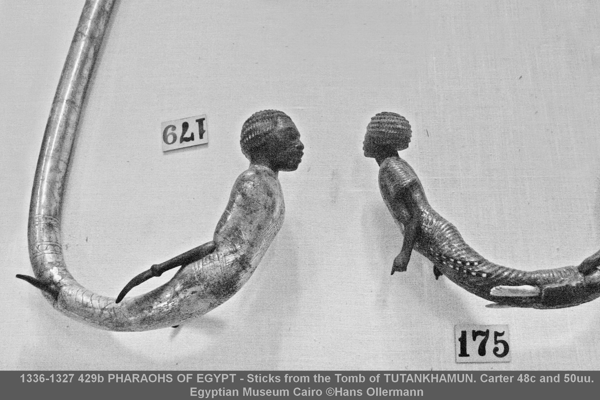 Sticks from the Tomb of TUTANKHAMUN. Carter 48c and 50uu. Egyptian Museum Cairo :copyright:Hans Ollermann Stick with crook composed of bound African prisoner. CARTER 48c BURTON 335 JE 61736; Exhib. 179 and Ceremonial stick of unknown use (detail). CARTER 50uu BURTON 338-341. JE 61732; Exhib. 175