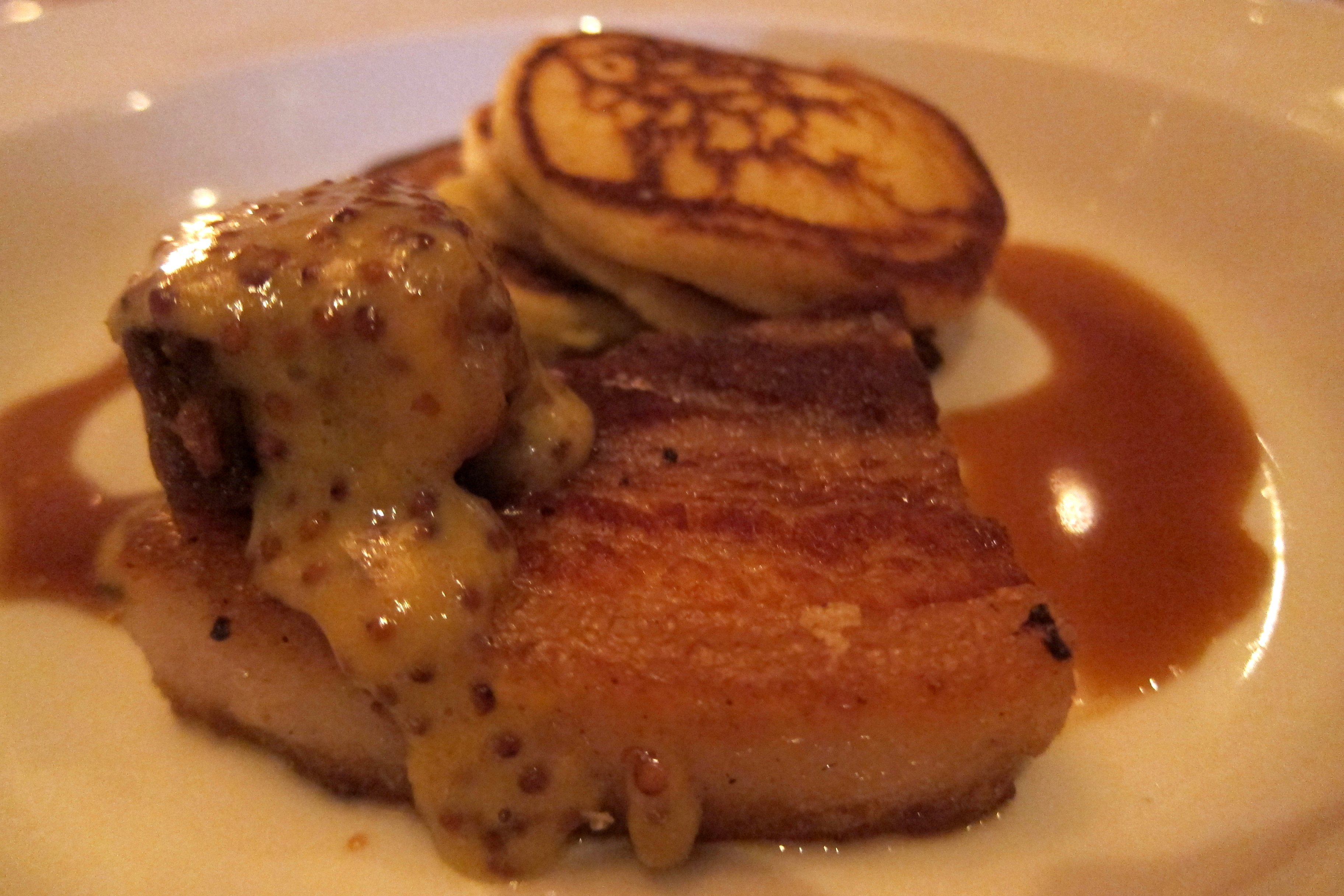 Atlanta - Westside: JCT Kitchen & Bar - Pork Belly Griddled Gun Creek Pork Belly w Johnny Cake short stack, Coca Cola & country ham jus, sorghum mustard JCT Kitchen & Bar, located at 1198 Howell Mill Road in Atlanta's Westside Urban Market, was opened in 2007 by Executive chef Ford Fry.