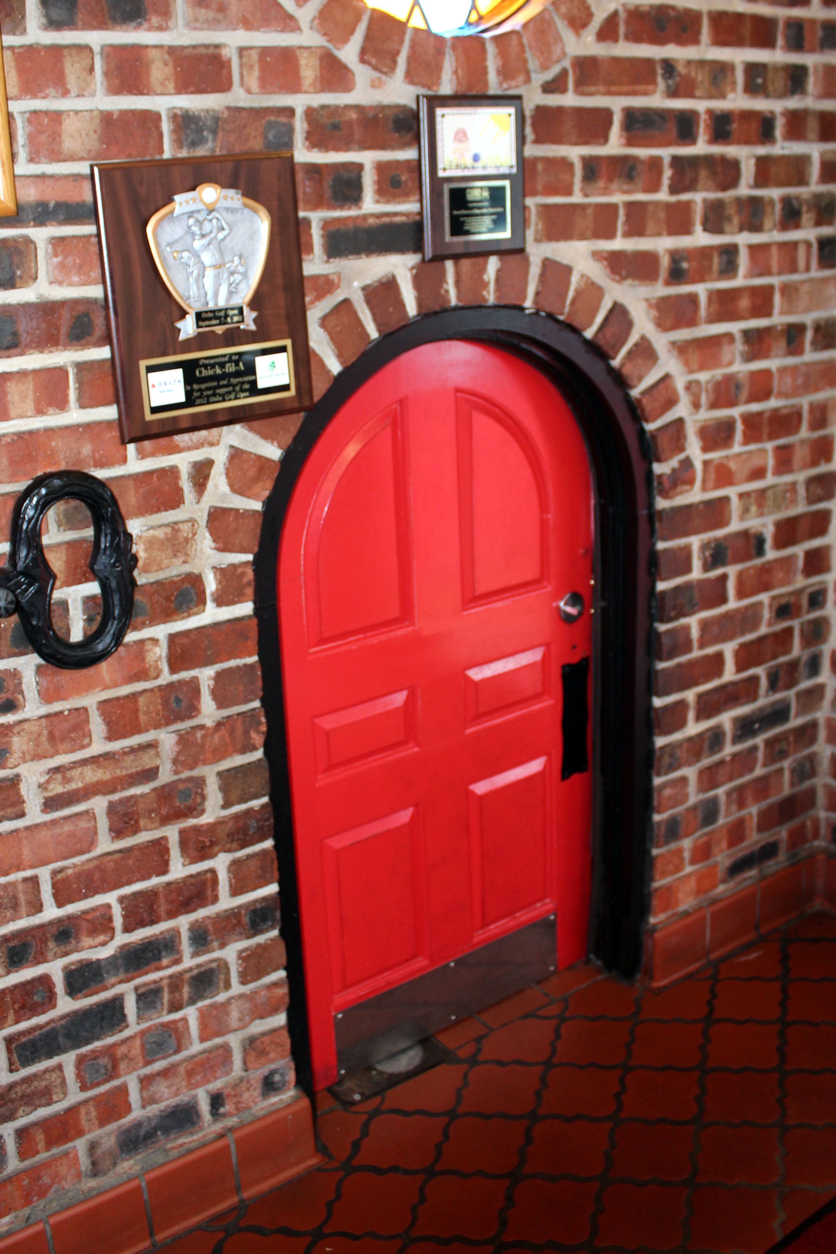 Hapeville: Chick-fil-A at Hapeville Dwarf House Chick-fil-A at Hapeville Dwarf House was first opened by Truetty Cathy in 1946 as The Dwarf Grill. It was here that Cathy invented the Chick-fil-A's boneless breast of chicken sandwich. In 1961 after finding a pressure-fryer that could cook the chicken sandwich in the same amount of time to cook a fast food hamburger, Cathy registered the name Chick-fil-A, Inc. and starting with a restaurant at a mall in suburban Atlanta in 1967 began to expand throughout the region. Today there are more than 1600 locations across 38 states. The Hapeville Dwarf House is one of 11 Dwarf House locations around Atlanta, all of which, unlike other Chick-fil-a locations, offer a full-service menu in addition to fast-food service. It features an extra small-sized front door and a motorized display of the seven dwarfs in the back.