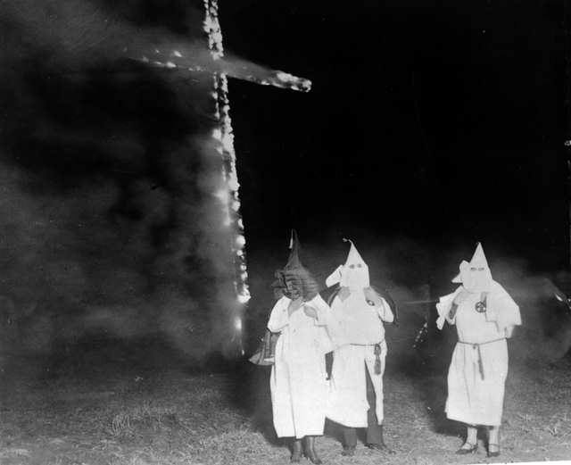 Ku Klux Klan members and a burning cross, Denver, Colorado, 1921 Ku Klux Klan members and a burning cross, Denver, Colorado, 1921