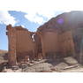 Qasr el Bint, Petra Qasr el Bint ('House of the Lady') is the best preserved of Petra's free standing / masonry buildings. Square in plan the ruin represents the main chamber of a 1st century BC temple dedicated to a local deity. There was formerly a columned portico at the entrance but this collapsed long ago, leaving behind the arched entrance and more austere walls at full height with an almost fortress-like appearance.