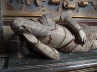 Francis Smith Effigy Monument to Francis Smith dating from c1605 in the south chapel at Wootton Wawen church. St Peter's at Wootton Wawen is one of Warwickshire's oldest churches, the lower half of the tower being a fairly complete structure from the 9th century. Beyond the Saxon core much of the present building owes it's present appearance to 14th and 15th century Perpendicular enlargement and remodellibng. Inside the east end of the nave comes as a bit of a shock as the Saxon arches beneath the tower are tiny, leaving an almost blank wall with barely a glimpse of the chancel beyond as the focal point. There are fiagments of medieval glass, 15th century parclose screens and several fine monuments of various dates amongst the antiquities of this church.