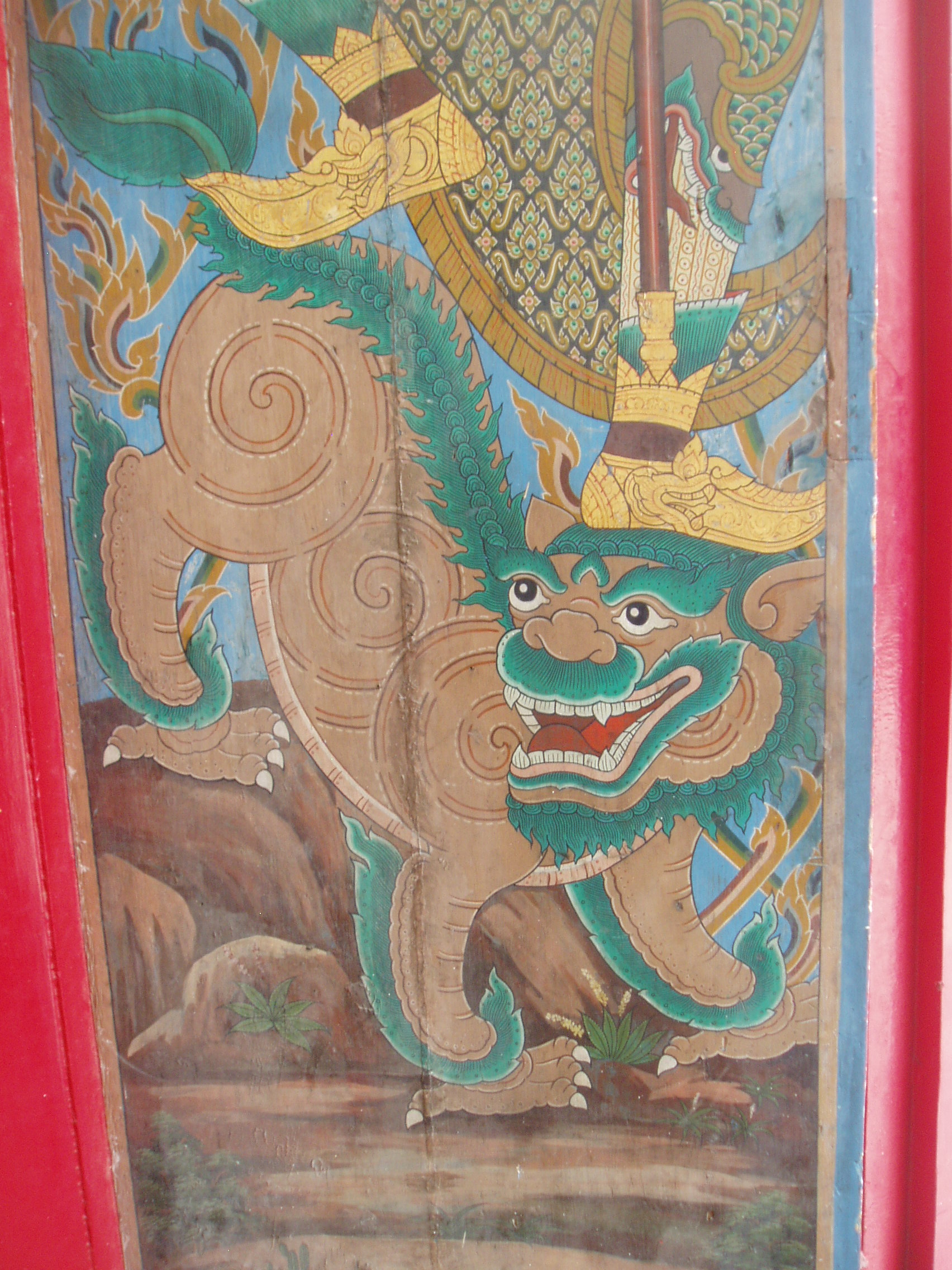 Wat Ratchabophit, Bangkok Wat Ratchabophit is one of the most unusual temples in Bangkok; built in the latter half of the 19th century it shows marked European influence in certain areas, such as the neo-gothic interior of the main bot (prayer hall) and many of the monuments in the adjoining Royal Cemetery, that includes a domed classical style tower and pinnacled gothic steeples amongst more traditional Thai and Khmer style structures. The centrepiece of the Temple is the huge tile-covered stupa that grows from the heart of the complex and is surrounded by a tight circular courtyard. The surrounding structures are richly decorated and gilded with typical Thai richness. The entrance gates to the temple compound have carved and painted door panels with bizarre figures that appear to be 'farang' (foreign/European) guards holding rifles! en.wikipedia.org/wiki/Wat_Ratchabophit