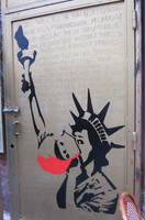 NYC - Little Italy: Gilf! "Lady Liberty drinks the Kool Aid in Little Italy" is a stencil painted by Bushwick-based street artist, Gilf!, along Mulberry Street in 2012 in conjunction with her show at Galerie Swanström and as a promotion for the New York City Comedy Festival and Vandalog's The Art of Comedy.