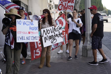 Anti-vaccine mandate protesters rally in Los Angeles, California